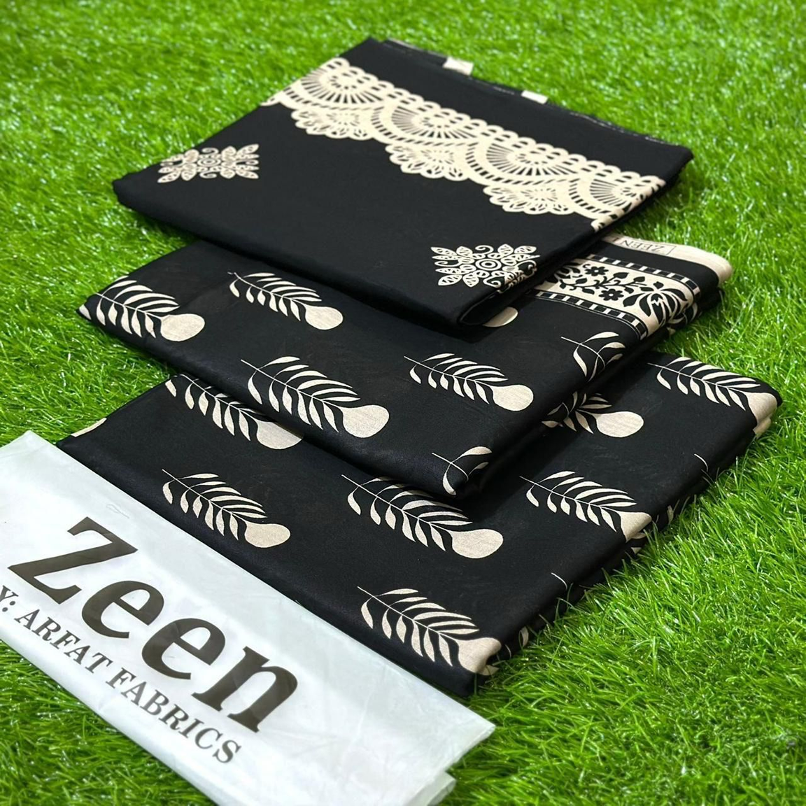 Zeen by Arfat Fabrics: Sophisticated Black Printed Lawn Suit with Elegant White Botanical & Lace-inspired Motifs – Unstitched Summer Collection