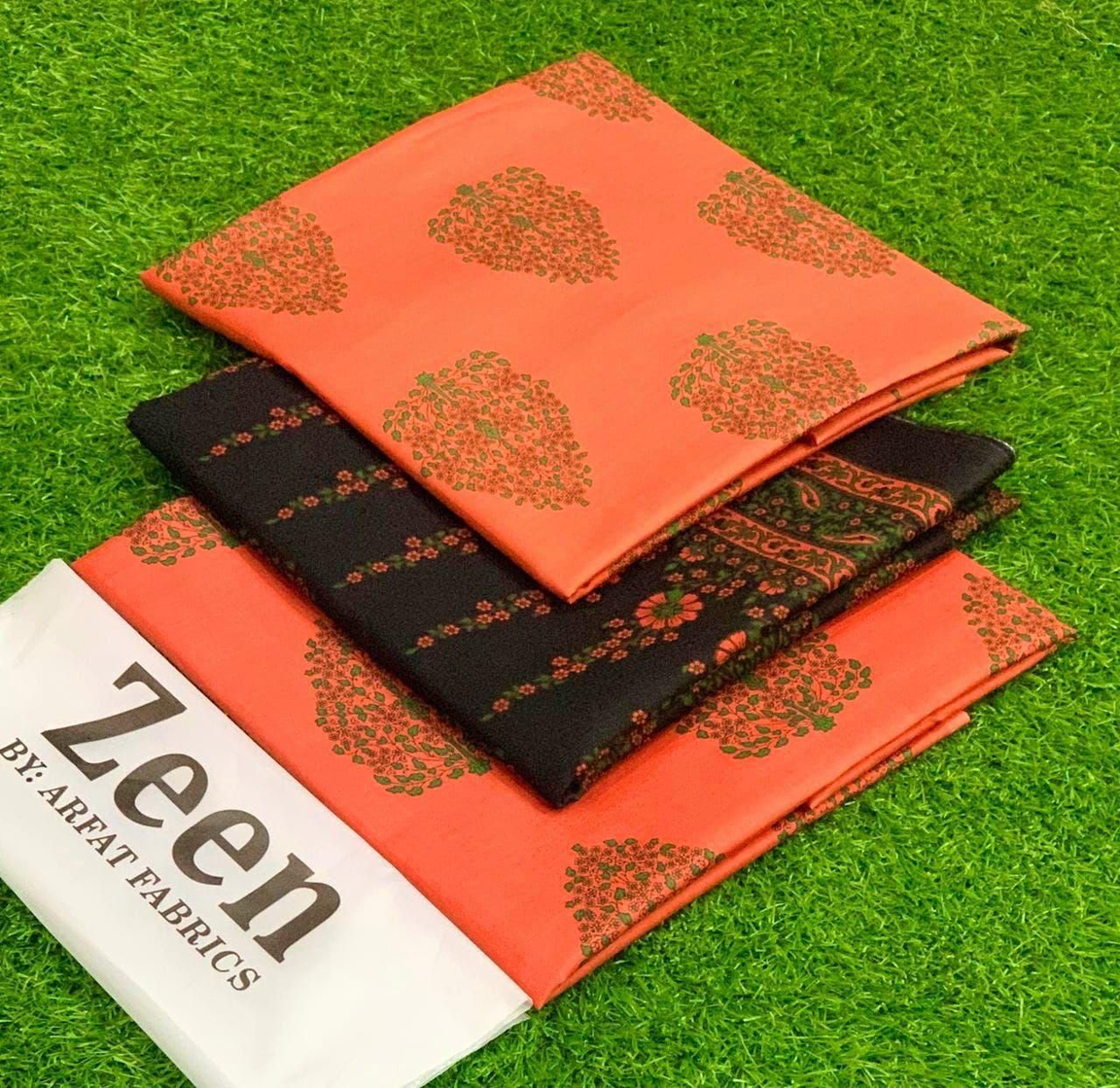 Zeen by Arfat Fabrics: Striking Orange & Black Printed Lawn Suit with Traditional & Floral Motifs – Unstitched Summer Collection